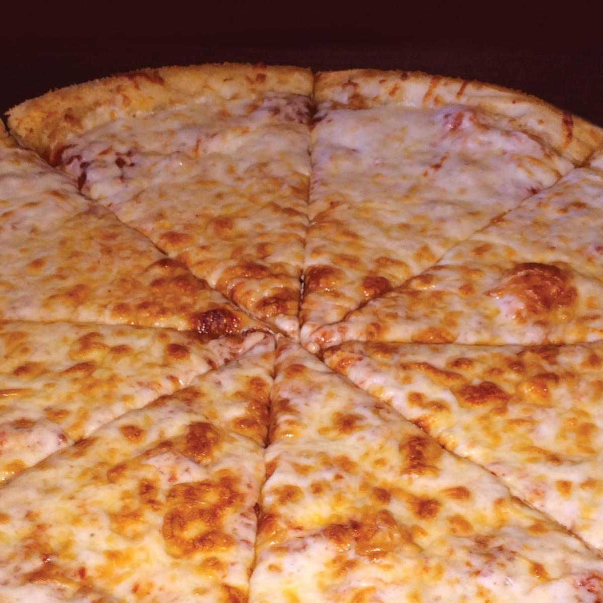 A creamy pile of 100% mozzarella & parmesan cheese. - Schmizza Pub & Grub - Cornell Portland, OR