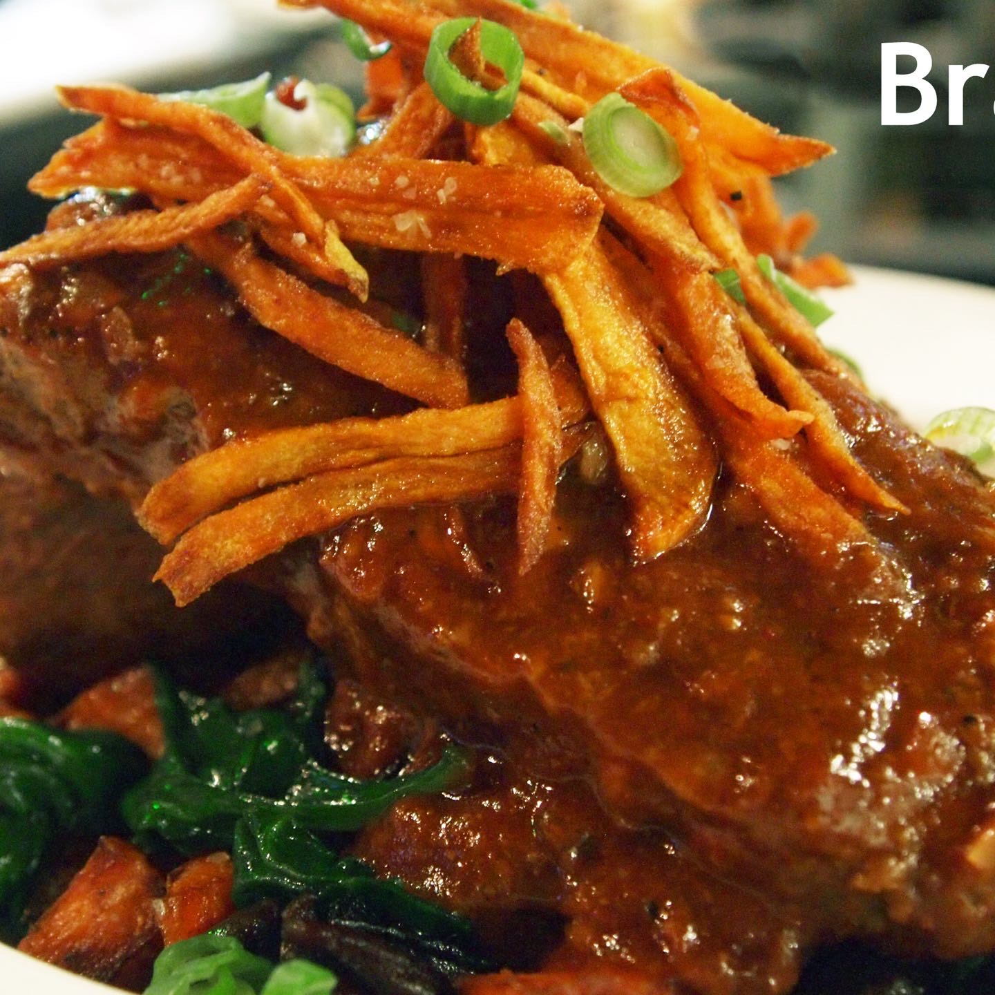 Tender-braised marinated pork shoulder, served with sautéed spinach, mushrooms and sweet potato hash